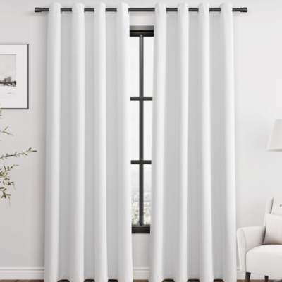 Minimalist pure white cotton-linen blackout curtains (grommet style); textured fabric for temperature control and light blocking; suitable for bedrooms, balconies, and sliding doors.