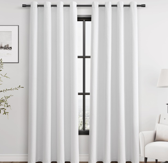Minimalist pure white cotton-linen blackout curtains (grommet style); textured fabric for temperature control and light blocking; suitable for bedrooms, balconies, and sliding doors.
