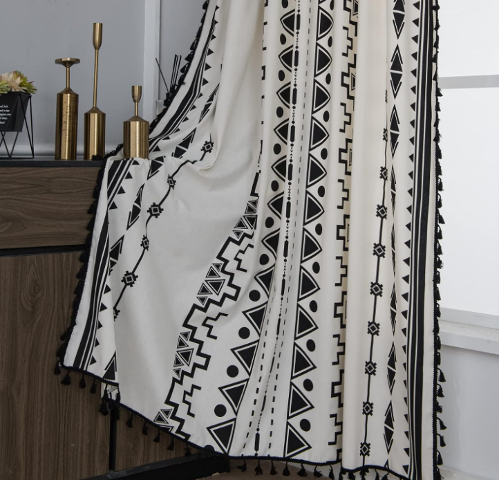 Black and white geometric print cotton-linen semi-blackout curtain (single panel); Bohemian tassel style with grommet hanging; distinctive decor for bedrooms.